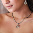 ENCIRCLE YOUR HEART IN PERIDOT PENDANT