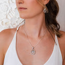 ENCIRCLE YOUR HEART IN ZIRCONIA PENDANT