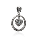 ENCIRCLE YOUR HEART IN TOPAZ PENDANT